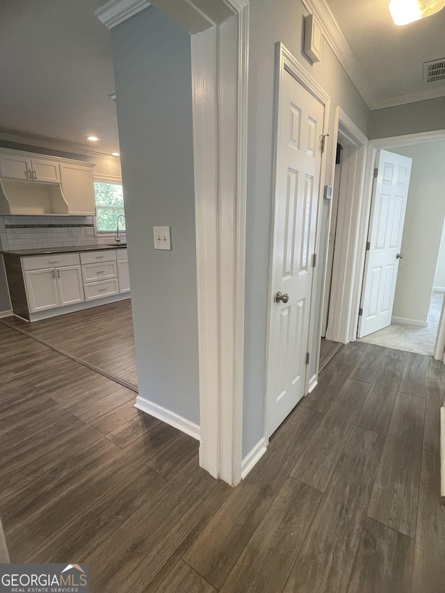 1833 Phillips Ave, East Point, GA 30344 - corridor featuring dark wood-style floors, crown molding, and recessed lighting