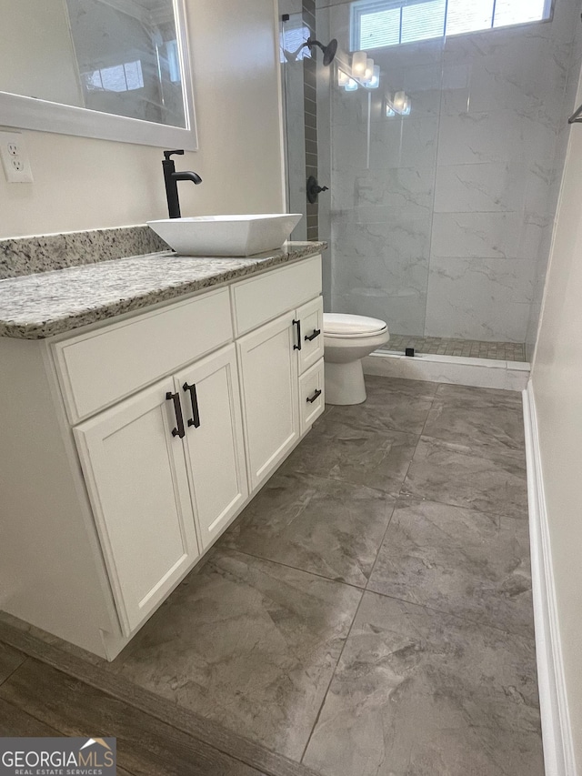 1833 Phillips Ave, East Point, GA 30344 - bathroom with marble finish flooring, vanity, and a marble finish shower