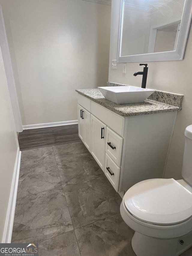 1833 Phillips Ave, East Point, GA 30344 - bathroom featuring marble look tile flooring and vanity