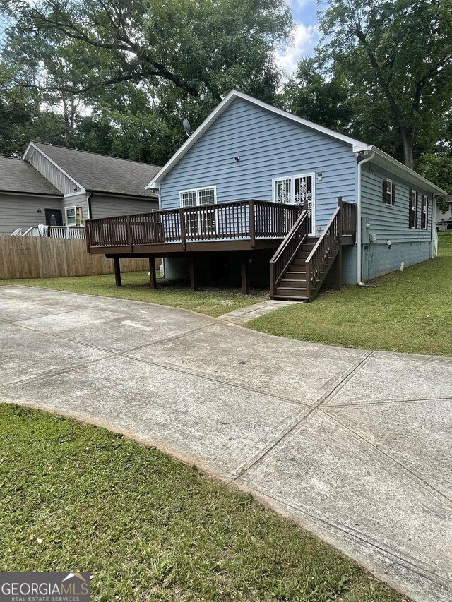 1833 Phillips Ave, East Point, GA 30344 - back of house with a wooden deck and crawl space