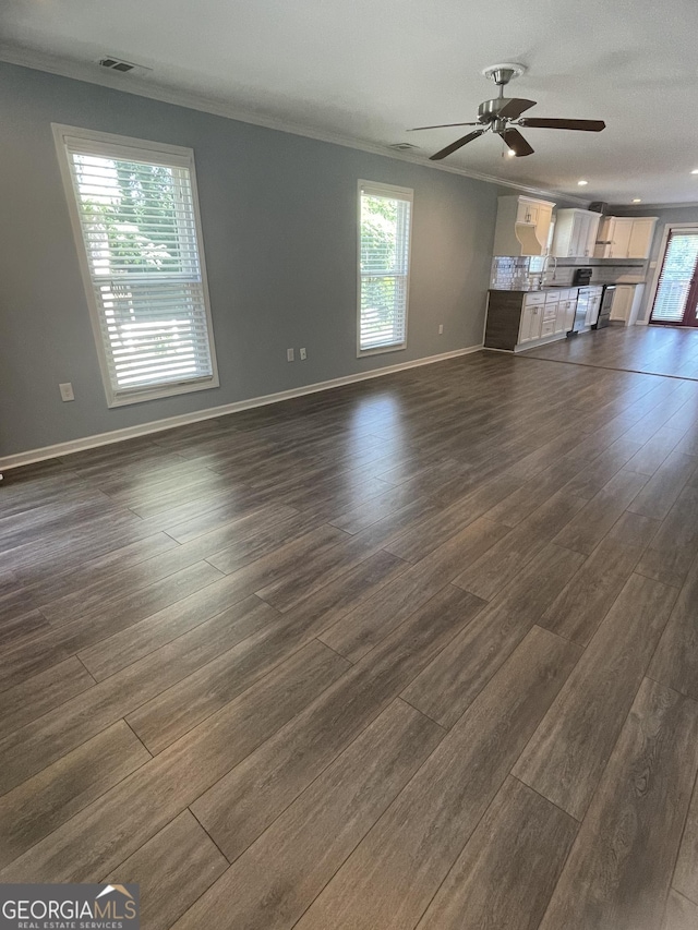 1833 Phillips Ave, East Point, GA 30344 - unfurnished living room with dark wood-style flooring, ornamental molding, and ceiling fan
