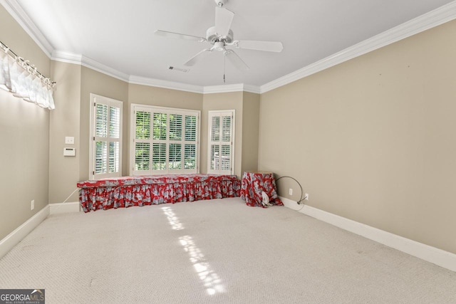 914 Champions Way, Mcdonough, GA 30252 - spare room with crown molding, carpet, and a ceiling fan