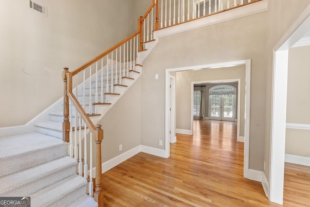914 Champions Way, Mcdonough, GA 30252 - stairs featuring wood finished floors and a high ceiling