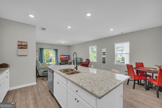 264 Golden Eagle Pkwy, Braselton, GA 30517 - kitchen featuring dishwasher, light wood-style flooring, healthy amount of natural light, white cabinets, and recessed lighting