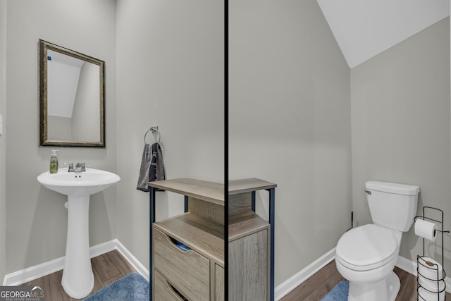 264 Golden Eagle Pkwy, Braselton, GA 30517 - half bathroom featuring wood finished floors and vaulted ceiling