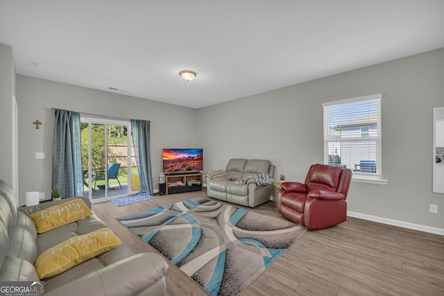 264 Golden Eagle Pkwy, Braselton, GA 30517 - living area featuring wood finished floors and baseboards