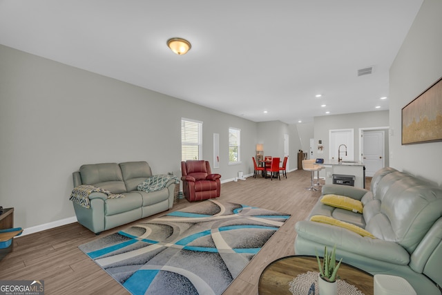 264 Golden Eagle Pkwy, Braselton, GA 30517 - living area featuring wood finished floors and recessed lighting