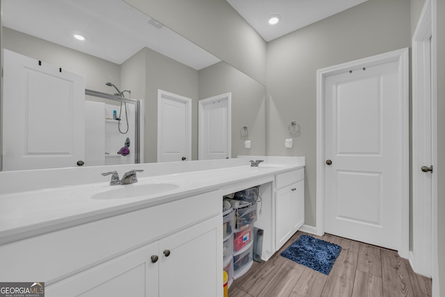 264 Golden Eagle Pkwy, Braselton, GA 30517 - bathroom with double vanity and wood finished floors