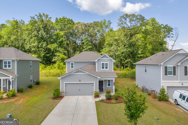 264 Golden Eagle Pkwy, Braselton, GA 30517 - view of front facade featuring driveway, board and batten siding, a front yard, and an attached garage