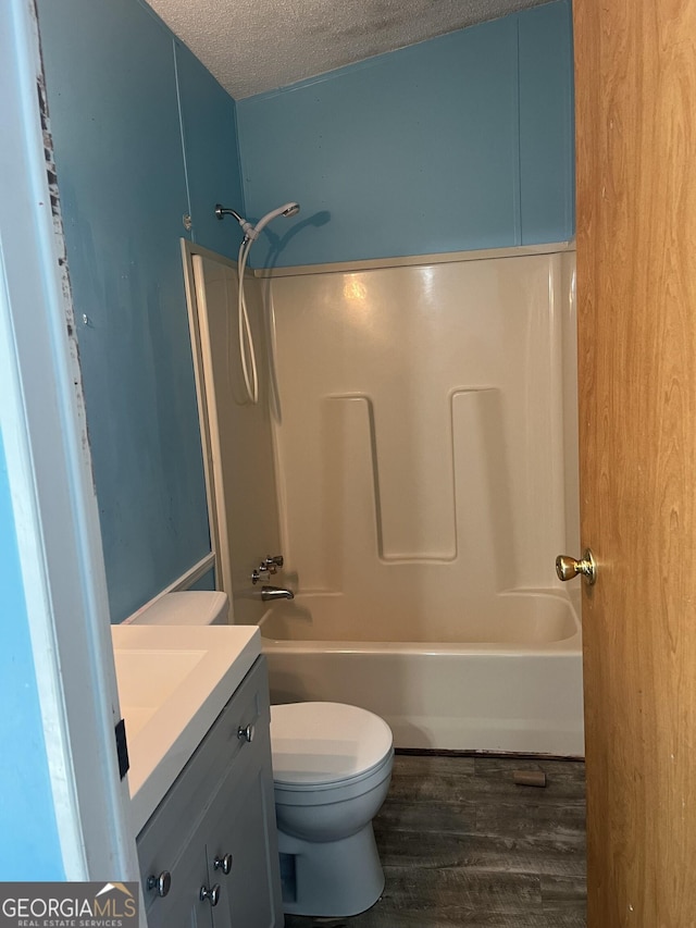 818 Arch Tanner Rd, Bethlehem, GA 30620 - full bath featuring wood finished floors, vanity, a textured ceiling, and  shower combination