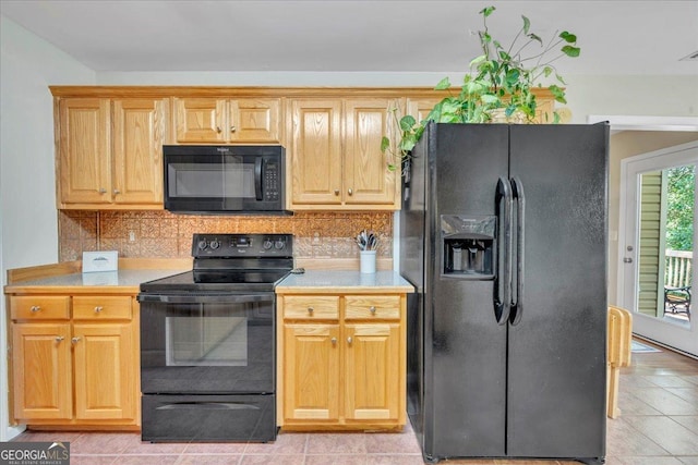 536 Sam Brown Blvd, Commerce, GA 30529 - kitchen with black appliances, light countertops, decorative backsplash, and light tile patterned floors