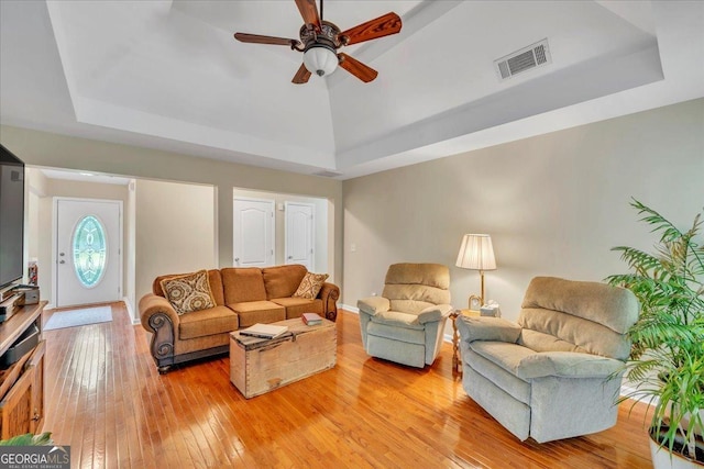 536 Sam Brown Blvd, Commerce, GA 30529 - living room with a tray ceiling, light wood-type flooring, and ceiling fan