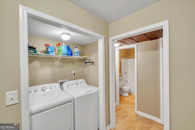 536 Sam Brown Blvd, Commerce, GA 30529 - laundry area featuring washing machine and clothes dryer and light tile patterned flooring