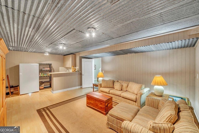 536 Sam Brown Blvd, Commerce, GA 30529 - living room featuring wood finished floors and wood walls