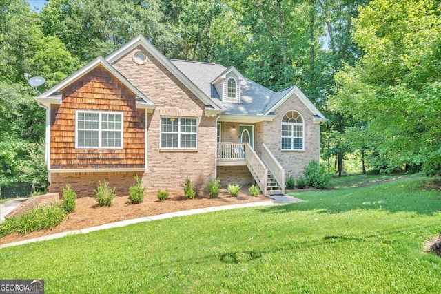 536 Sam Brown Blvd, Commerce, GA 30529 - view of front facade featuring a front yard, brick siding, and view of wooded area