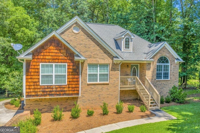 536 Sam Brown Blvd, Commerce, GA 30529 - view of front of home with brick siding, a front lawn, and a shingled roof