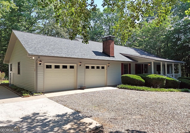 77 Chestatee Dr, Blairsville, GA 30512 - view of front of home featuring an attached garage, gravel driveway, a shingled roof, and a chimney
