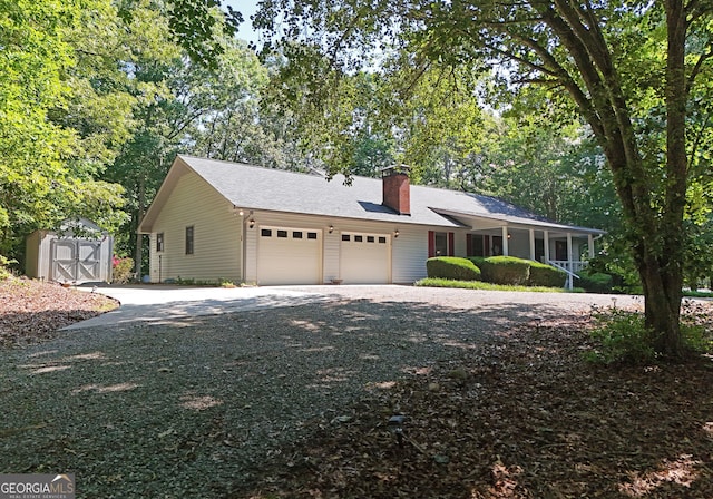 77 Chestatee Dr, Blairsville, GA 30512 - ranch-style home with a garage, a shed, driveway, and a chimney