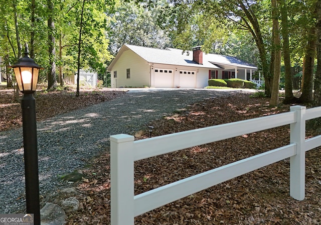 77 Chestatee Dr, Blairsville, GA 30512 - view of front of house featuring an attached garage, driveway, and a chimney