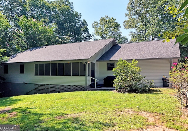 77 Chestatee Dr, Blairsville, GA 30512 - rear view of house with a lawn, a shingled roof, and a sunroom