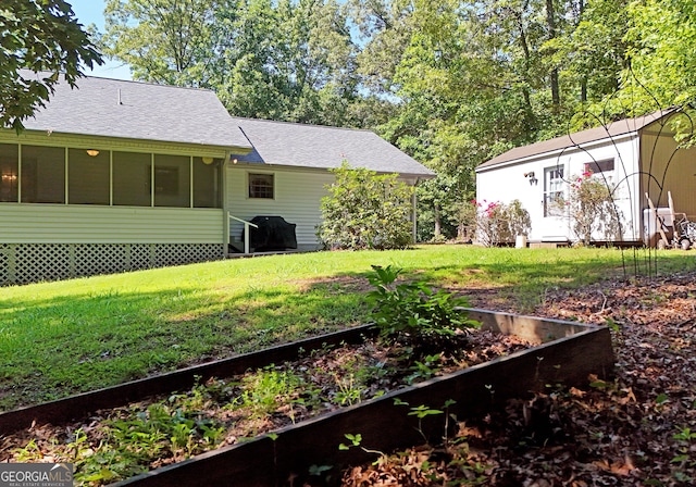 77 Chestatee Dr, Blairsville, GA 30512 - view of green lawn featuring a garden and an outdoor structure