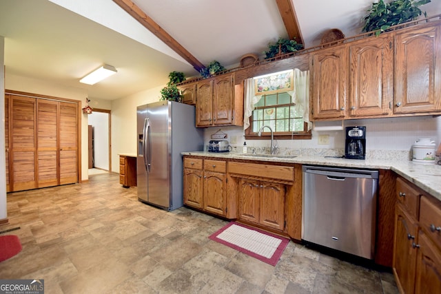 77 Chestatee Dr, Blairsville, GA 30512 - kitchen featuring appliances with stainless steel finishes, brown cabinetry, stone finish flooring, and light stone counters