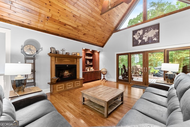 712 Meadow Run Ct, Clarkesville, GA 30523 - living room with high vaulted ceiling, plenty of natural light, wood ceiling, a lit fireplace, and light wood finished floors