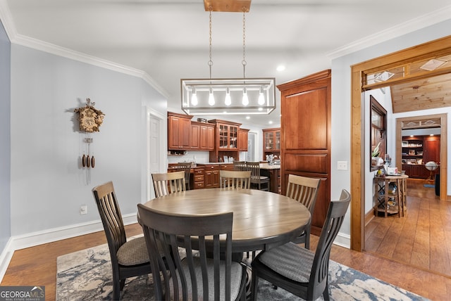 712 Meadow Run Ct, Clarkesville, GA 30523 - dining space featuring wood finished floors, crown molding, and recessed lighting