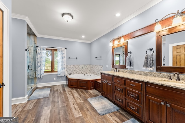 712 Meadow Run Ct, Clarkesville, GA 30523 - full bathroom featuring double vanity, a bath, a stall shower, wood finished floors, and ornamental molding