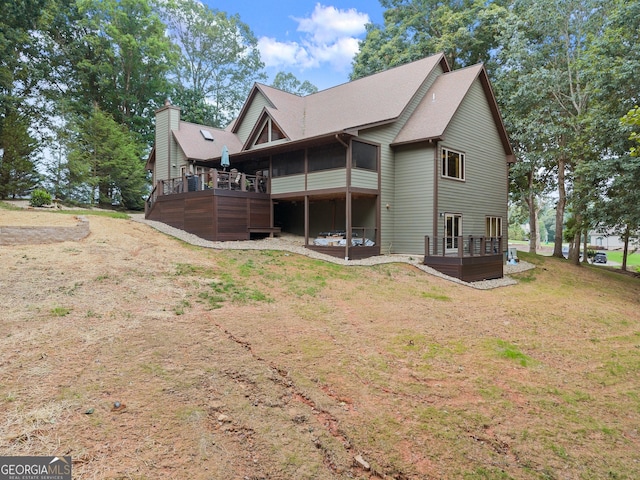 712 Meadow Run Ct, Clarkesville, GA 30523 - view of home's exterior with a deck, a sunroom, a yard, and roof with shingles