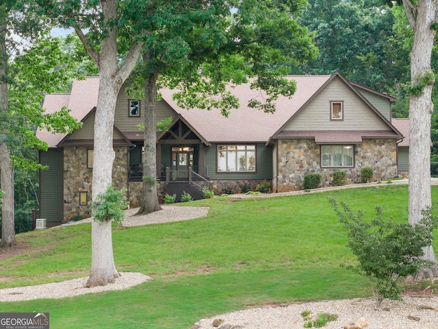 712 Meadow Run Ct, Clarkesville, GA 30523 - view of front facade featuring stone siding, a front yard, and a shingled roof