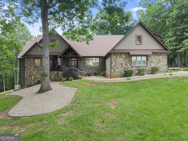 712 Meadow Run Ct, Clarkesville, GA 30523 - view of front of house featuring stone siding, a front yard, covered porch, and roof with shingles