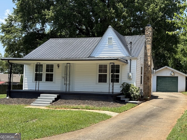 1220 Harmony St, Gainesville, GA 30501 - view of front of home with an outbuilding, a porch, a chimney, concrete driveway, and a metal roof
