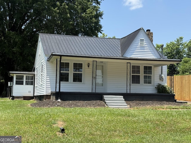 1220 Harmony St, Gainesville, GA 30501 - view of front facade with a metal roof, a chimney, and covered porch