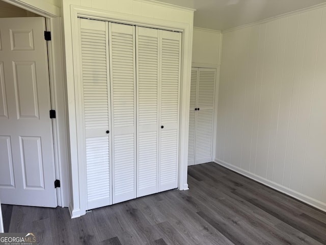 1220 Harmony St, Gainesville, GA 30501 - unfurnished bedroom with a closet and dark wood-type flooring