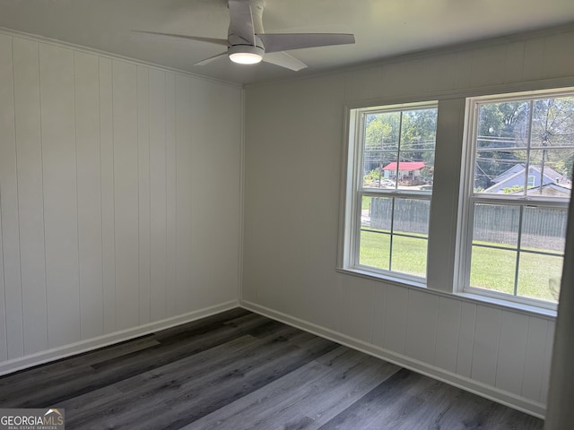 1220 Harmony St, Gainesville, GA 30501 - spare room with dark wood finished floors, ceiling fan, and ornamental molding