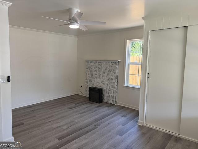 1220 Harmony St, Gainesville, GA 30501 - unfurnished living room featuring a ceiling fan, wood finished floors, and ornamental molding