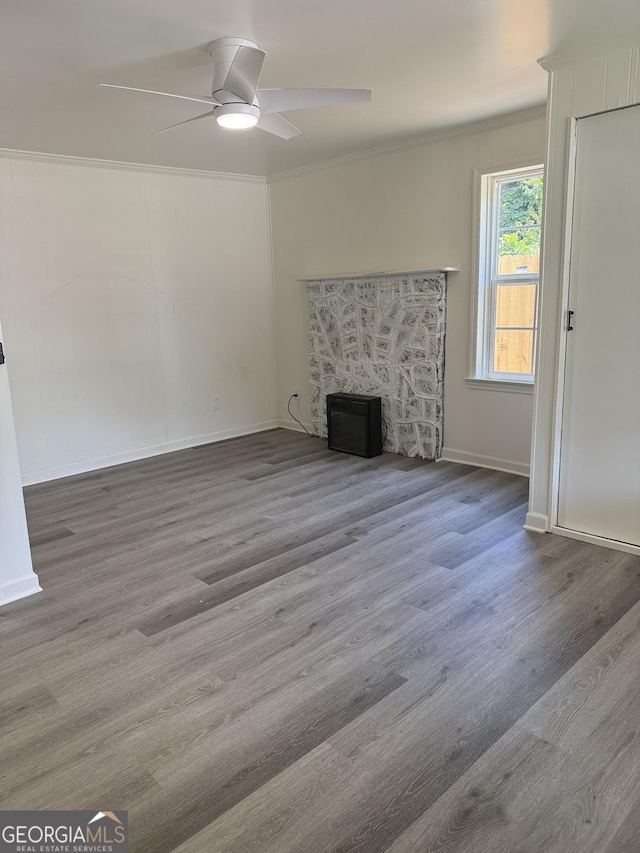1220 Harmony St, Gainesville, GA 30501 - unfurnished living room featuring a ceiling fan, wood finished floors, a fireplace, and ornamental molding