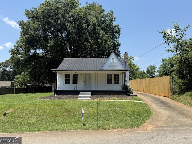 1220 Harmony St, Gainesville, GA 30501 - bungalow-style house featuring covered porch, a chimney, a metal roof, and concrete driveway