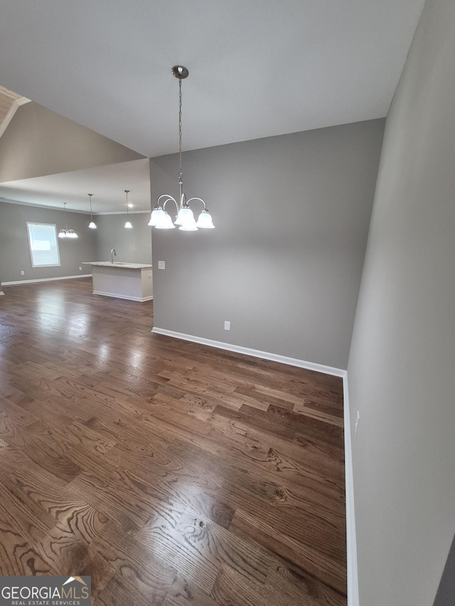 1090 Fox Glen Dr, Watkinsville, GA 30677 - unfurnished dining area with dark wood-style flooring and a chandelier