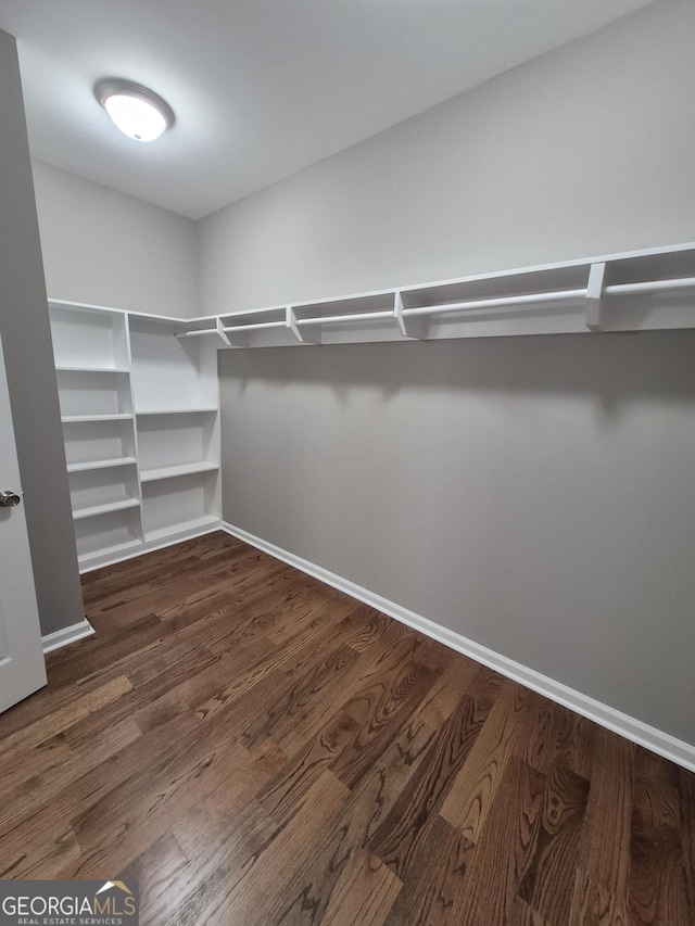 1090 Fox Glen Dr, Watkinsville, GA 30677 - walk in closet with dark wood-style floors