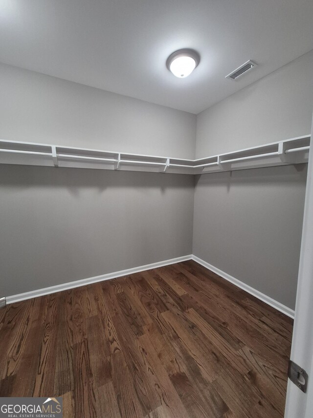 1090 Fox Glen Dr, Watkinsville, GA 30677 - spacious closet featuring dark wood-type flooring