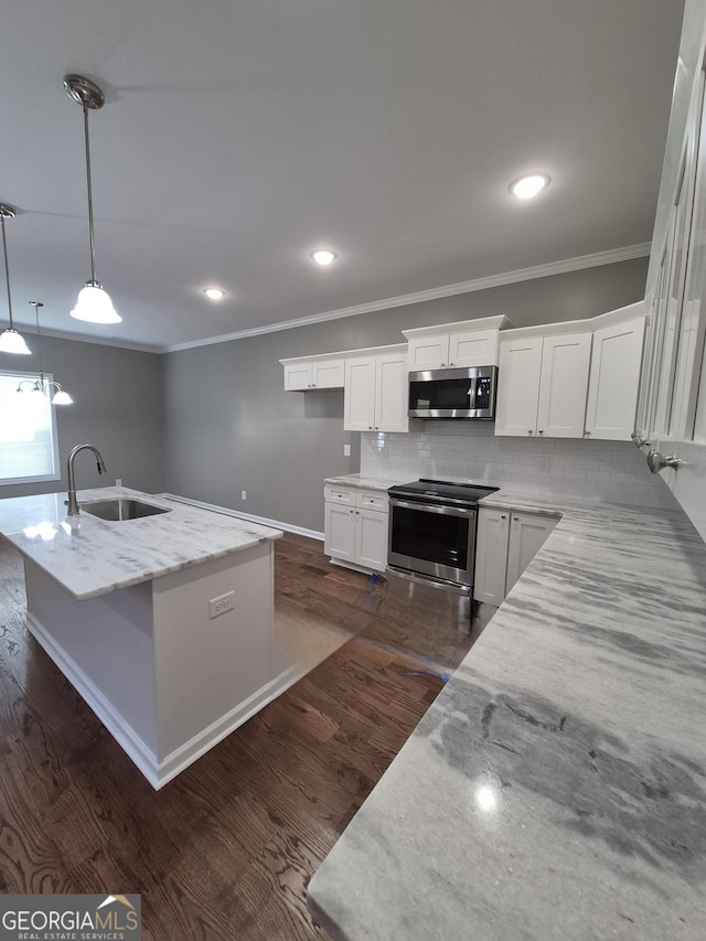 1090 Fox Glen Dr, Watkinsville, GA 30677 - kitchen featuring stainless steel appliances, crown molding, white cabinetry, light stone counters, and backsplash