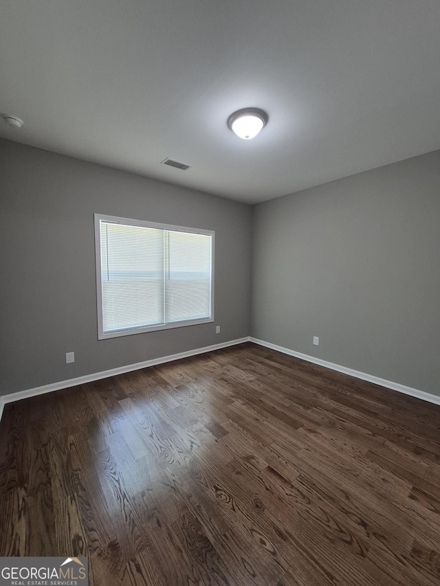 1090 Fox Glen Dr, Watkinsville, GA 30677 - spare room with dark wood finished floors and a smoke detector
