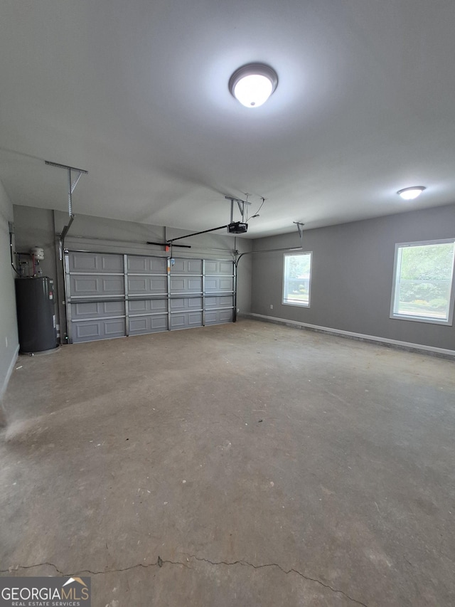 1090 Fox Glen Dr, Watkinsville, GA 30677 - garage with water heater and a garage door opener