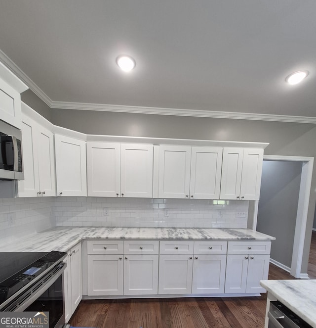 1090 Fox Glen Dr, Watkinsville, GA 30677 - kitchen with crown molding, stainless steel appliances, white cabinets, tasteful backsplash, and light stone counters