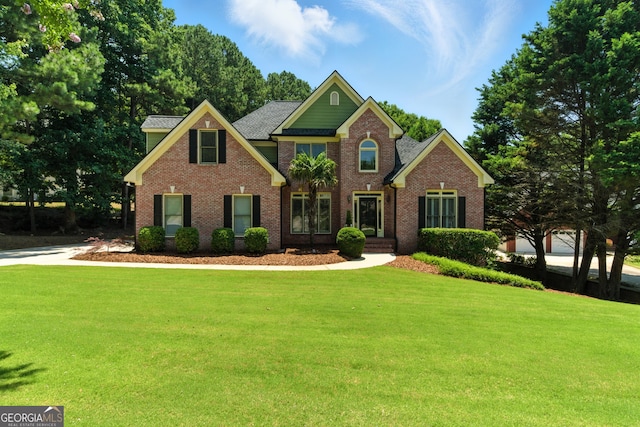 2832 Windrush Dr, Buford, GA 30518 - view of front facade featuring a front lawn and brick siding