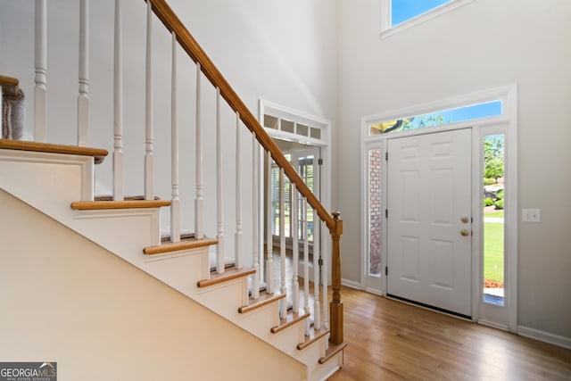 2832 Windrush Dr, Buford, GA 30518 - foyer with stairs, wood finished floors, and a towering ceiling