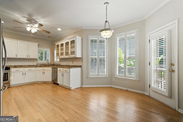 2832 Windrush Dr, Buford, GA 30518 - kitchen featuring stainless steel dishwasher, glass insert cabinets, light wood-style floors, white cabinets, and ornamental molding