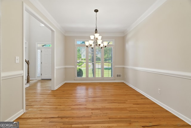 2832 Windrush Dr, Buford, GA 30518 - unfurnished room with a chandelier, light wood-style flooring, and ornamental molding